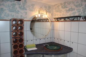 a bathroom with a sink and a mirror at Bio Erlebnishof Grittel in Grittel