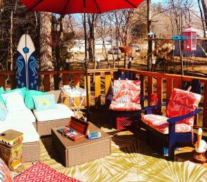 a patio with two chairs and an umbrella at Walking Distance To Beach And Shops in New Buffalo