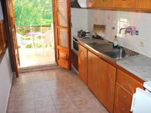 a kitchen with a sink and a stove at Kotroni studios in Skiathos