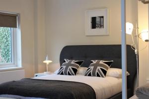 Ένα ή περισσότερα κρεβάτια σε δωμάτιο στο RIOSHOUSE George-Inn