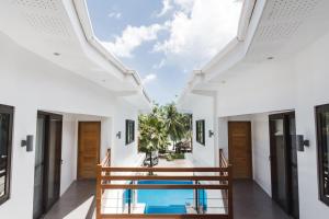a view of the pool from the house at The Whitehouse by the Sea in Panglao Island