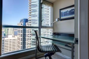 a view from a window of a building with a view of the ocean at Carmana Plaza in Vancouver