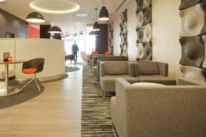 a living room filled with lots of furniture at ibis London Blackfriars in London