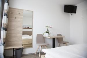 Postel nebo postele na pokoji v ubytování Gästehaus Pusztablick