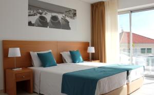 Tempat tidur dalam kamar di Casa Praia Mar