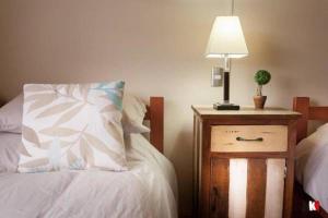 Rúm í herbergi á Innata Casa Hostal