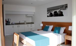 Tempat tidur dalam kamar di Casa Praia Mar