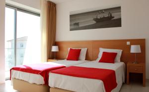 Tempat tidur dalam kamar di Casa Praia Mar