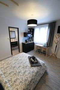 a bedroom with a bed with a tray on it at Le Nid Bord De La Loire in Orléans