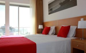 Tempat tidur dalam kamar di Casa Praia Mar