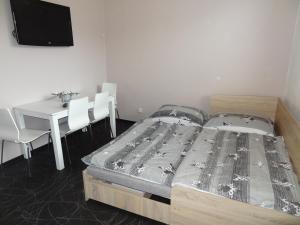 Posteľ alebo postele v izbe v ubytovaní Apartmán Lednická
