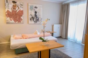 Ein Bett oder Betten in einem Zimmer der Unterkunft Exclusive Holiday Apartments