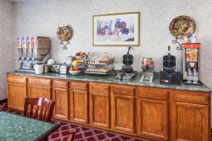 a kitchen with a counter with food on it at Baymont by Wyndham New Buffalo in New Buffalo