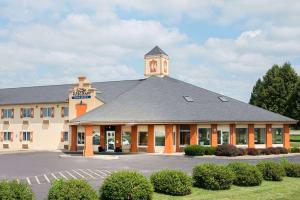 a building with a clock tower on top of it at Baymont by Wyndham Pella in Pella