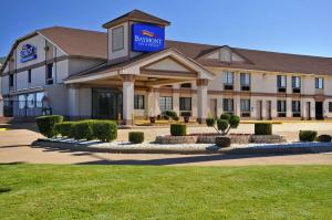 a hotel building with a sign on top of it at Baymont by Wyndham Oklahoma City Airport in Oklahoma City