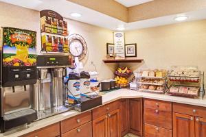 a grocery store with a counter with food at Baymont by Wyndham Indianapolis in Indianapolis