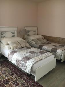 Uma cama ou camas num quarto em B&B Friedau