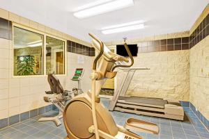 a room with a gym with a treadmill at Baymont by Wyndham Wahpeton in Wahpeton