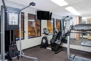 a gym with tread machines and a treadmill at Baymont Inn & Suites by Wyndham San Marcos in San Marcos