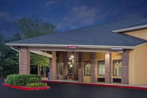a rendering of a house with a porch at Baymont by Wyndham Smyrna in Atlanta