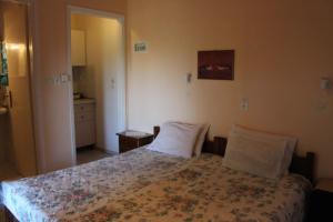 A bed or beds in a room at Villa Nefeli