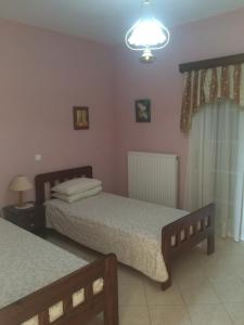 A bed or beds in a room at Villa Nefeli