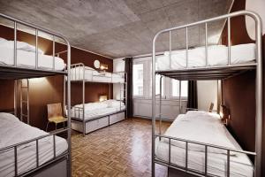 Ένα ή περισσότερα κρεβάτια σε δωμάτιο στο Five Elements Hostel and Capsules Frankfurt