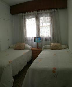 Un pat sau paturi într-o cameră la La Explanada