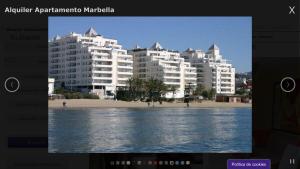 a picture of a beach with buildings in the background at Apartamento Marbella Playa in Marbella