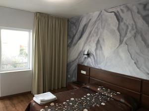 Postel nebo postele na pokoji v ubytování Hostal Juli