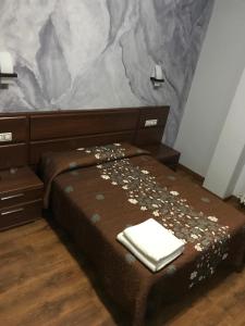 Postel nebo postele na pokoji v ubytování Hostal Juli