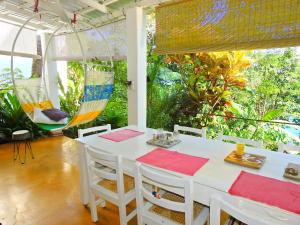 a white table and chairs in a room with trees at Casa Bella in La Laguna