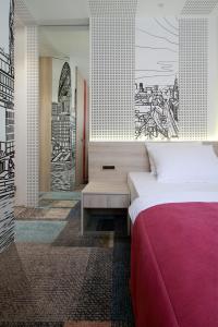 Letto o letti in una camera di Hotel Cosmopolit