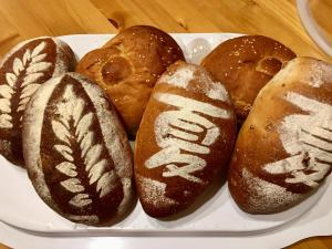 a plate of different types of bread on a table at Summer Homestay in Kenting