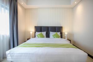 Postel nebo postele na pokoji v ubytování Loumage S Suites and Spa