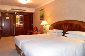Voodi või voodid majutusasutuse Evergreen Laurel Hotel Taipei toas