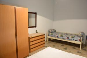 Ένα ή περισσότερα κρεβάτια σε δωμάτιο στο Casa Marinella