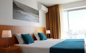 Tempat tidur dalam kamar di Casa Praia Mar