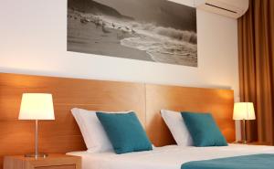 Tempat tidur dalam kamar di Casa Praia Mar