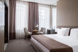 Кровать или кровати в номере Бутик-отель «1852»