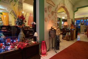a room with a store with vases on a table at Hotel Varonos in Delphi