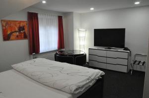 Postel nebo postele na pokoji v ubytování Hôtel du Chasseur
