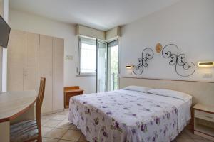 Postel nebo postele na pokoji v ubytování Ancora Hotel & Residence + 20 fotografií