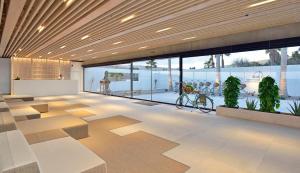 a lobby with a bike in the middle of a building at INNSiDE by Meliá Fuerteventura – Adults Only in Costa Calma