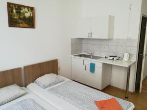 Posteľ alebo postele v izbe v ubytovaní Capital Guesthouse Budapest