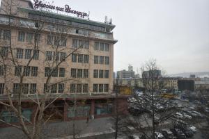 a building with a sign on the top of it at T apartment in Ulaanbaatar