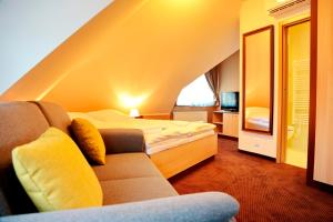Säng eller sängar i ett rum på Hotel Zamek Berchtold
