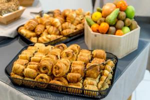 three trays of food on a table with fruits and vegetables at Thalacap Île de Ré - Thalasso & Spa in Ars-en-Ré
