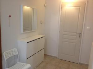a bathroom with a sink and a mirror and a toilet at Hawaii in Nea Michaniona +27 photos
