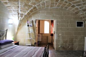 Postel nebo postele na pokoji v ubytování White Suite B&B